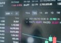 Bitcoin futures trading graph with rising open interest amidst regulatory symbols.