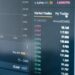 A visual representation of cryptocurrency trades and tax documents on a digital screen.