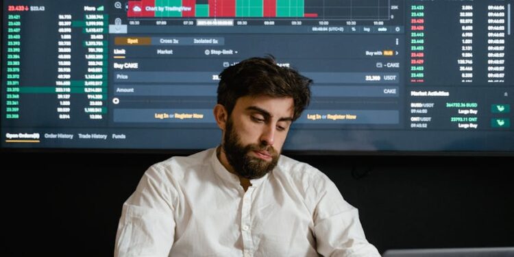 A trader monitoring cryptocurrency prices on a digital screen with Bitcoin and Ethereum charts.