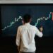 A trader analyzes Bitcoin charts on a digital screen with financial data and graphs visible.