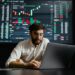 Crypto trader analyzing charts on a laptop, with oil barrel and dollar signs in the background.
