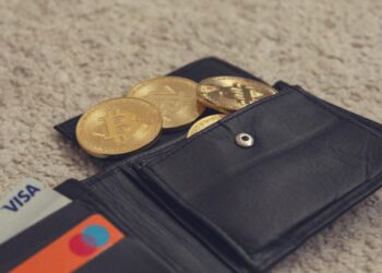 Crypto gift cards displayed with a digital wallet and KYC compliance documents.