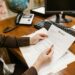 A lawyer reviewing documents related to a cryptocurrency lawsuit against W3C.