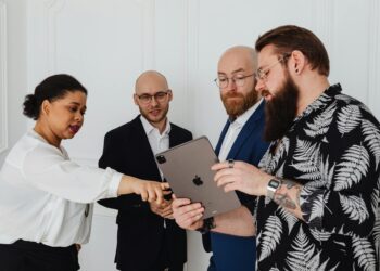 A fintech team discussing digital payment connections and regulatory updates at a conference.