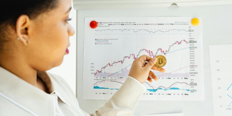 A financial advisor reviewing cryptocurrency options for 401(k) retirement plans.