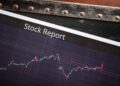A stock market display showing fluctuating oil futures prices with a CFTC logo.
