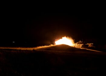Explosions light up the night sky near Bushehr amid escalating attacks and heightened tensions.
