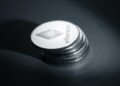 Ethereum cryptocurrency coins stacked on a digital exchange interface, representing a large transfer.