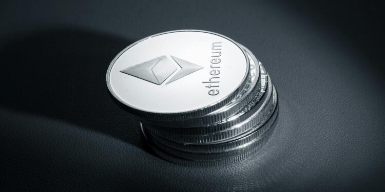 Stack of coins with Ethereum logo, symbolizing Bitmine's crypto asset acquisition.