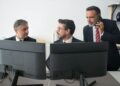Bank representatives discussing stablecoin regulations in a modern office setting.