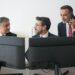 Bank representatives discussing stablecoin regulations in a modern office setting.