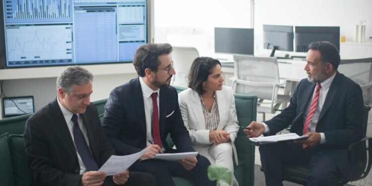 Banking officials discuss stablecoin regulations in a financial conference setting.