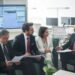 Banking officials discuss stablecoin regulations in a financial conference setting.