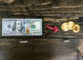 Cryptocurrency exchange logo surrounded by dollar signs and blockchain graphics.