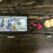 Cryptocurrency exchange logo surrounded by dollar signs and blockchain graphics.