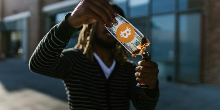 Fire visual representing a cryptocurrency token burn and buyback, with coins dissipating into smoke.
