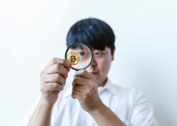 FBI agents examining documents related to crypto finance amidst a backdrop of digital currency symbols.