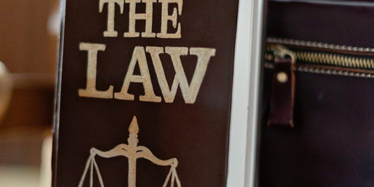 A courtroom with legal books and papers, emphasizing the xAI lawsuit against Senate Bill 24-205.