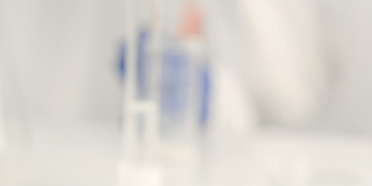 Vaccination research laboratory with scientists studying vaccine data and responses.