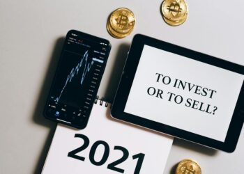 A smartphone screen displaying the Western Union logo next to cryptocurrency icons.