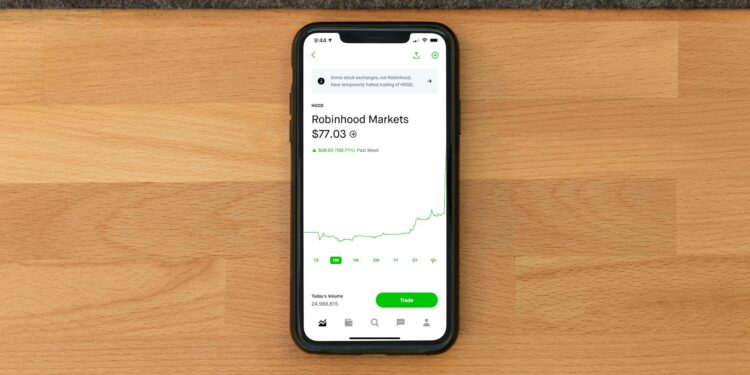 A stock market chart showing a downward trend with a focus on Robinhood's logo.