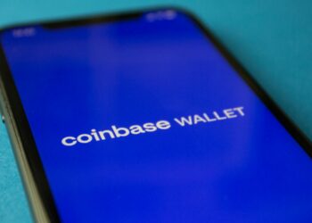 Coinbase's logo with a gavel, symbolizing regulatory approval in cryptocurrency finance.