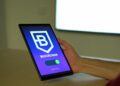 A graphic showing a digital wallet interface with cryptocurrency icons and regulatory symbols.