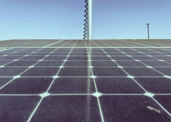 Satellite capturing solar energy with AI data center in the background, symbolizing innovation.
