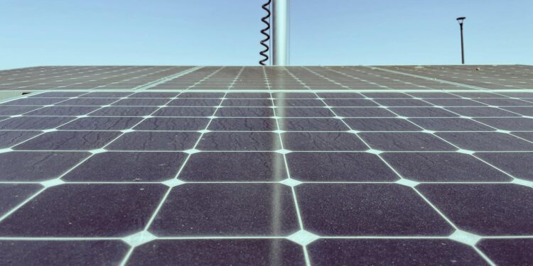 Satellite capturing solar energy with AI data center in the background, symbolizing innovation.