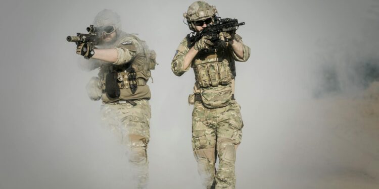 Troops using advanced AI technology for military targeting operations.