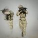 Troops using advanced AI technology for military targeting operations.
