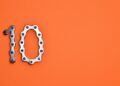 A digital illustration of the Solana logo with broken chains symbolizing an exploit.
