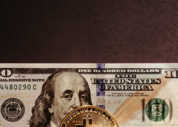 Fiat and crypto currency symbols interconnected, representing financial integration.