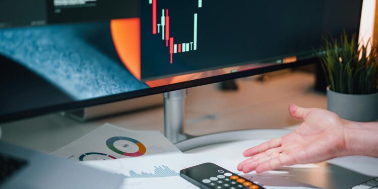 A financial expert analyzing cryptocurrency regulations and sanctions risks at a desk.