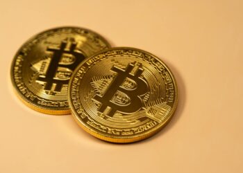 SBI Holdings executives discuss Bitbank acquisition amidst cryptocurrency market changes.