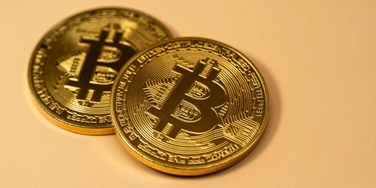 SBI Holdings executives discuss Bitbank acquisition amidst cryptocurrency market changes.