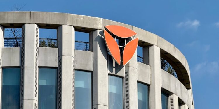 A Bithumb office building with cryptocurrency logos, reflecting recent legal changes.