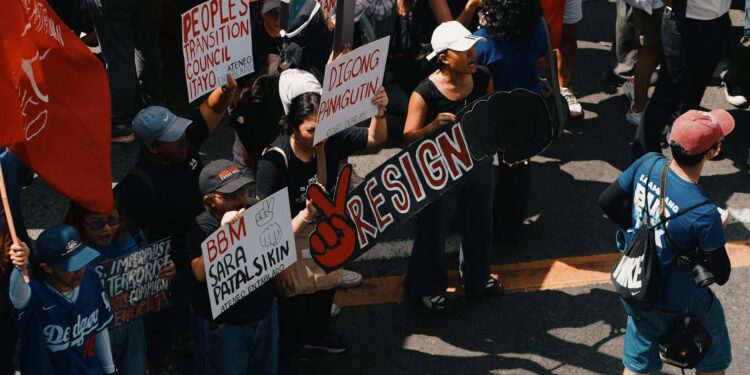 People rallying with signs advocating for cryptocurrency regulation reforms.