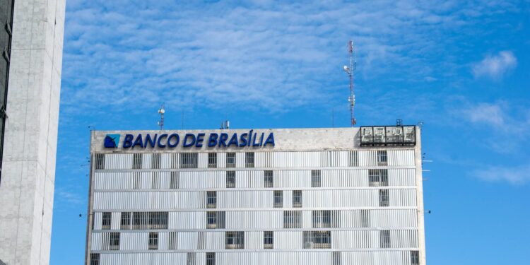 A Brazilian Central Bank building with cryptocurrency symbols in front, indicating regulatory changes.