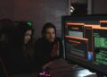 Cybersecurity experts analyzing data on screens to address crypto threats from Lazarus.