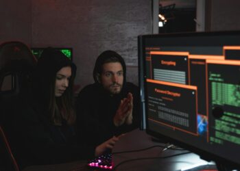 Cybersecurity experts analyzing data on screens to address crypto threats from Lazarus.