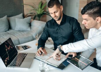 Team of financial professionals collaborating on cryptocurrency regulations and oversight strategies.