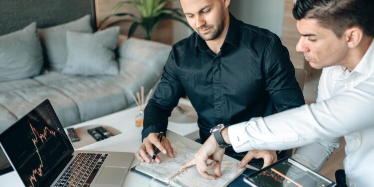 Team of financial professionals collaborating on cryptocurrency regulations and oversight strategies.
