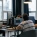Developers collaborating on Ethereum applications at a tech workspace.