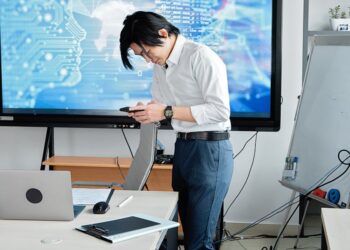 Military personnel and tech executives discuss AI technology in a conference room setting.