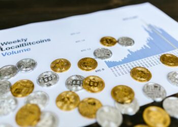 Financial charts and cryptocurrency symbols representing changes in crypto regulation in France.