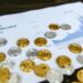 Financial charts and cryptocurrency symbols representing changes in crypto regulation in France.