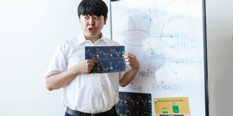 Michael Saylor speaking at a cryptocurrency conference, with Bitcoin charts displayed behind him.